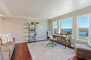 Home office featuring French doors and large windows with lake views