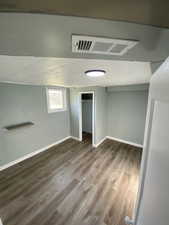 Basement featuring hardwood / wood-style flooring