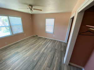 Interior space featuring dark hardwood / wood-style flooring and ceiling fan