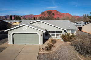 Single story home featuring a mountain view and a garage