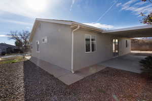 View of home's exterior with a patio area