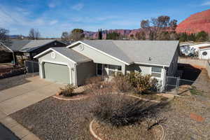 View of front of house featuring a mountain view and a garage