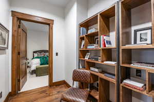 Living area with hardwood / wood-style floors