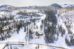 Snowy aerial view with a mountain view