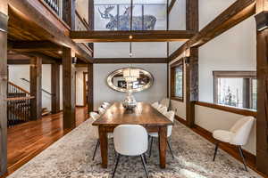 Dining space featuring hardwood / wood-style flooring and beamed ceiling