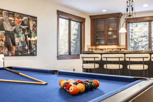 Rec room with pool table and bar area