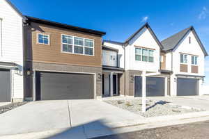 View of front facade featuring a garage