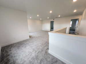 Unfurnished room with carpet flooring