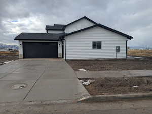 View of front of property featuring a garage