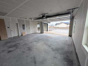 Garage with a garage door opener and electric panel