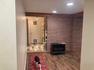 Unfurnished living room featuring hardwood / wood-style flooring