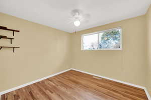 Unfurnished room featuring light hardwood / wood-style floors and ceiling fan