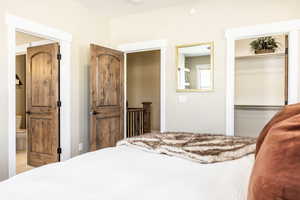 Bedroom featuring ensuite bath and a closet