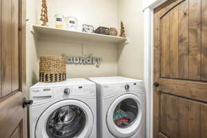 Laundry room featuring washing machine and dryer