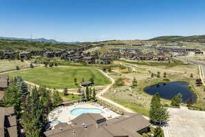 Aerial view featuring a water and mountain view