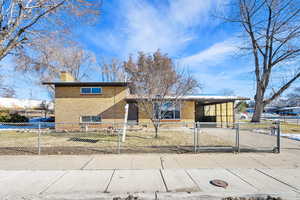 View of front of home with a carport