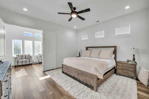 Bedroom featuring hardwood / wood-style floors and ceiling fan