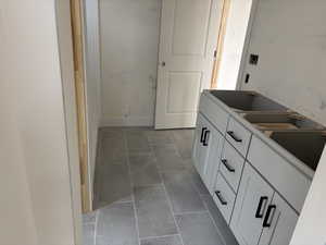 Bathroom featuring tile patterned floors and vanity