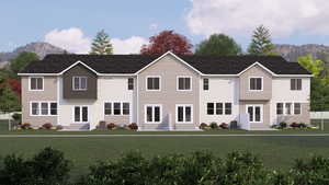 View of front facade featuring a mountain view and a front lawn