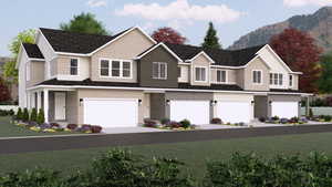 View of front facade with a mountain view and a garage