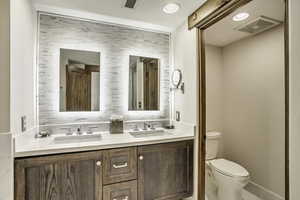 Bathroom with vanity and toilet