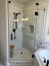 Bathroom featuring independent shower and bath and sink