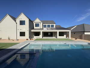 Rear view of property with a patio area