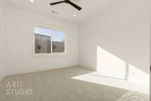 Carpeted empty room with ceiling fan