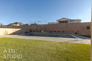 View of yard with a fenced in pool and a patio area