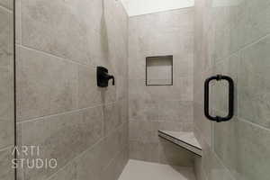 Bathroom featuring tiled shower