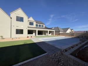 Exterior space with a lawn and a patio area