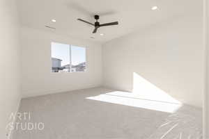 Carpeted empty room featuring ceiling fan