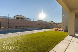 View of yard with a fenced in pool