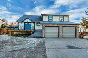 View of front facade featuring a garage