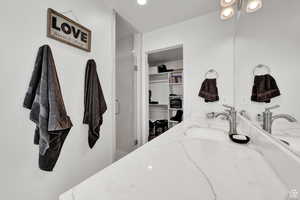 Bathroom featuring vanity and an enclosed shower