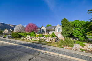 View of front of property with stucco siding and a mountain view