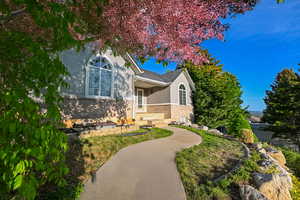 View of front of property featuring stucco siding and brick siding