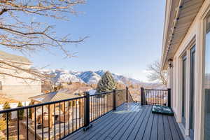 Wooden terrace featuring a mountain view