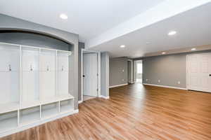 Mudroom featuring light wood-style floors, baseboards, and recessed lighting
