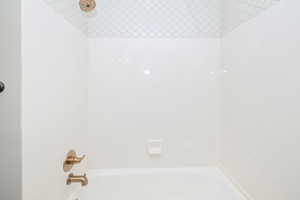 Bathroom featuring bathing tub / shower combination