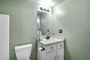 Bathroom featuring toilet and vanity