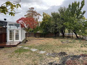 View of yard featuring a wooden deck