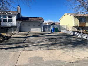 View of property exterior featuring a garage