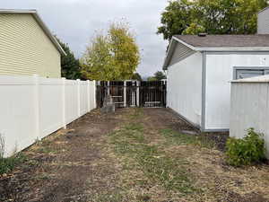 View of yard with a storage shed