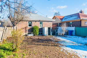 View of snow covered back of property