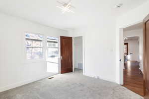 Unfurnished bedroom with carpet flooring