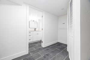 Bathroom with tile patterned flooring and vanity