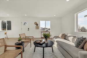 Living room featuring light hardwood / wood-style floors and a wealth of natural light