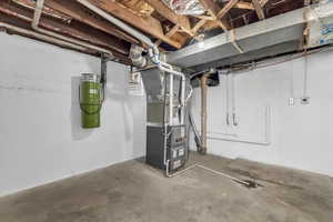 Basement featuring heating unit