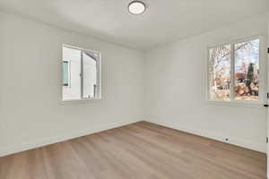 Empty room with light wood-type flooring